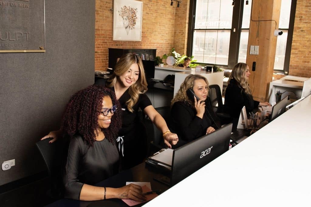 Patient coordinators at the front desk of the practice